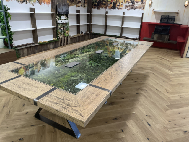 Office fit out in Coventry showcasing a creative table design with embedded greenery.